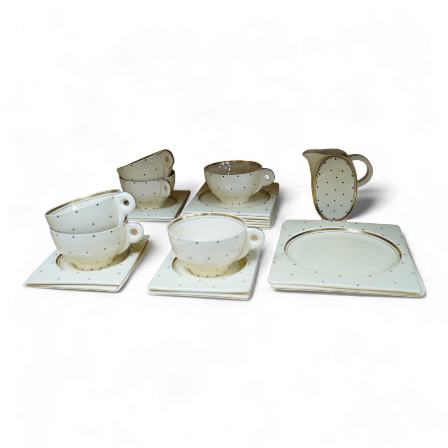 A Clarice Cliff Biarritz-shape 21-piece part teaset including trencher plates and saucers, impressed date-code 1935, jug 13cm